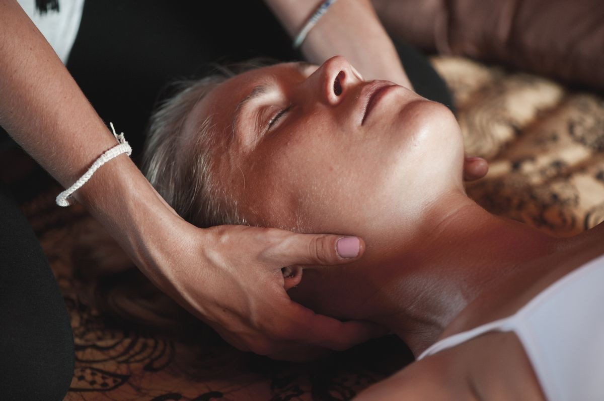 Massage concept. Beautiful young woman reciving relaxing massage